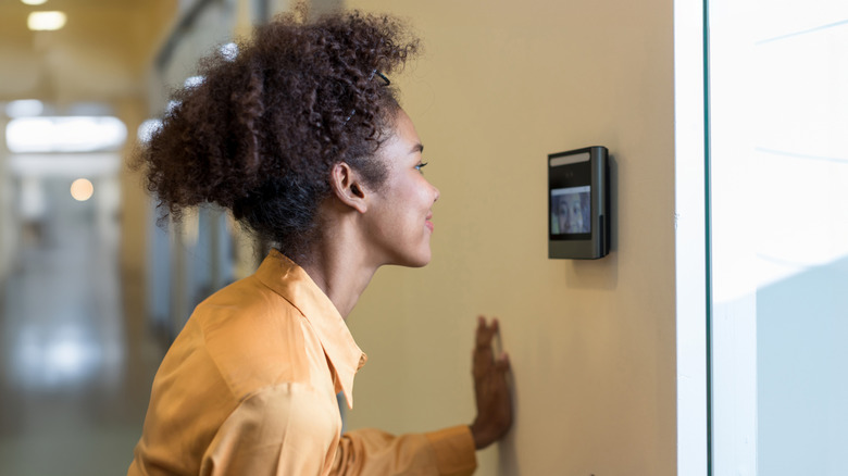 A woman using facial recognition software