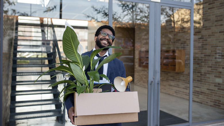 man leaving job smiling