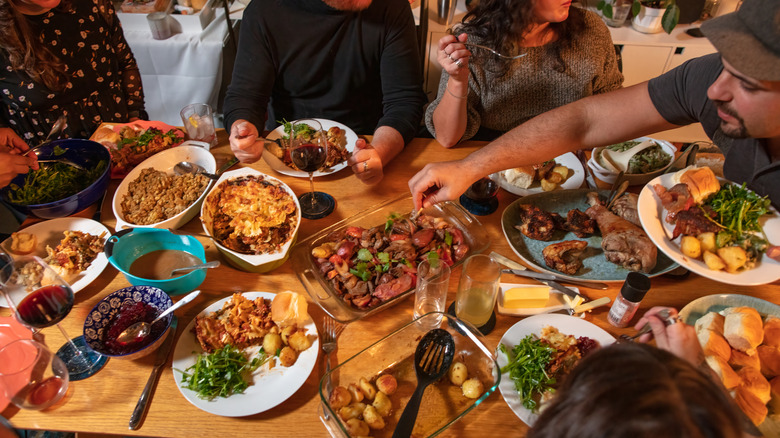 a group of people eating a meal together