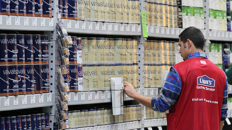 paint cans in a Lowe's