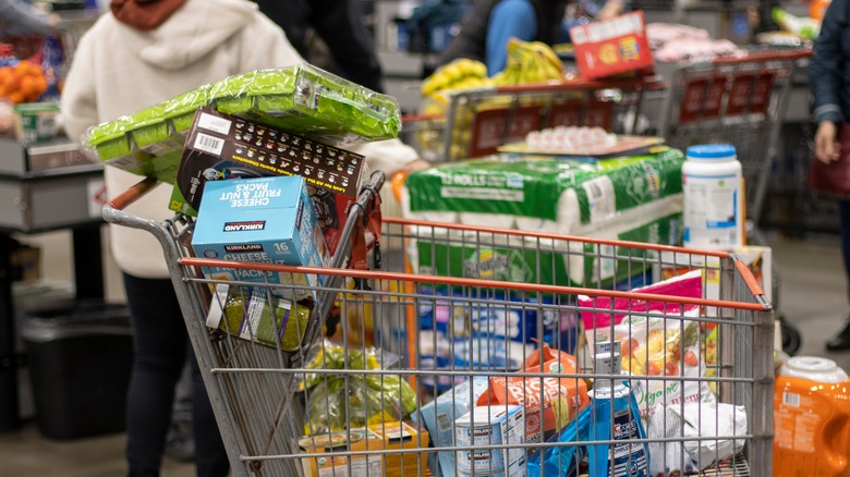 A full grocery cart full of food.