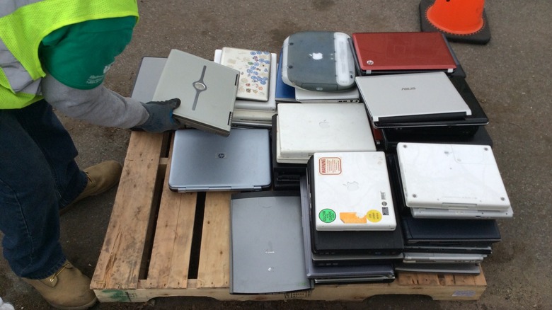 a pallet of old laptops to be disposed of properly