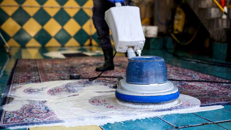 washing a rug with an industrial cleaner