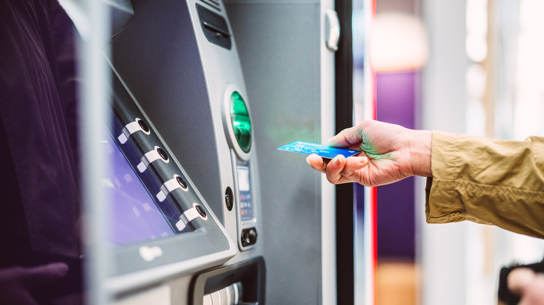 person using an ATM