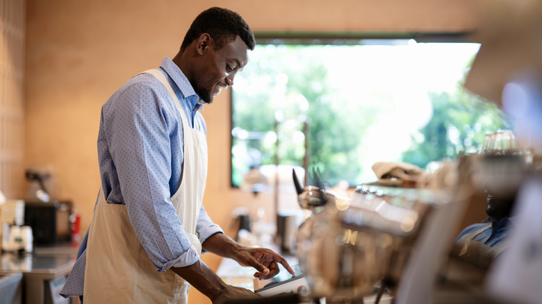 business owner working the counter