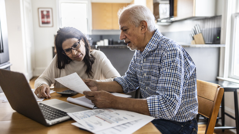 senior couple looking over finances together