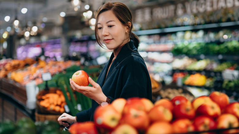 A woman grocery shopping