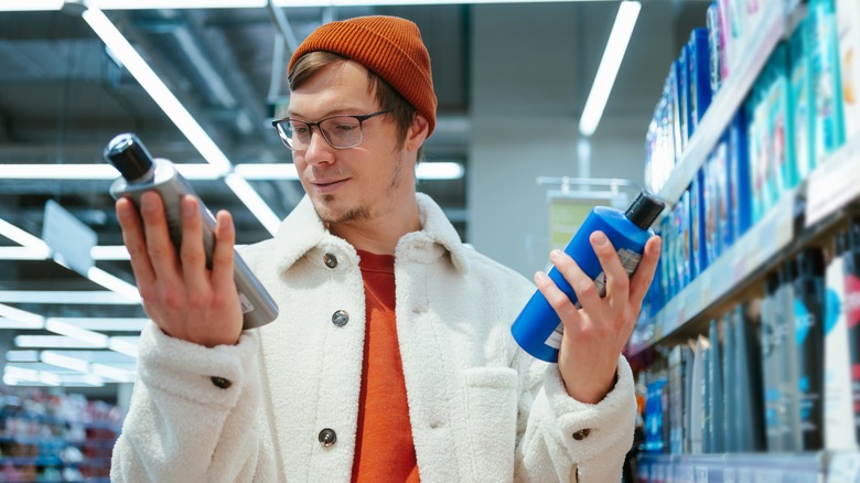 A man holding two store products