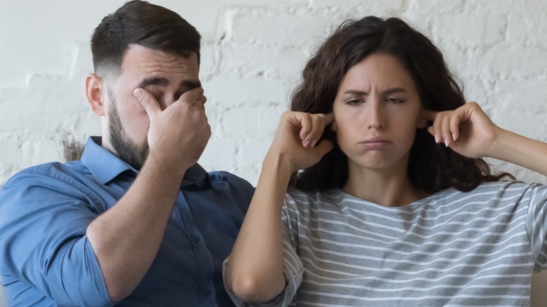 woman refusing to discuss money with her partner