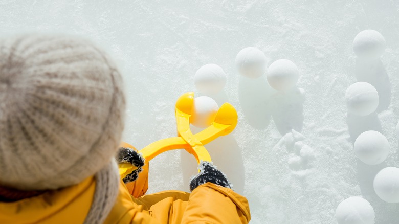 Child making snowballs