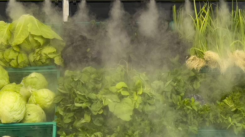 spraying produce with mist