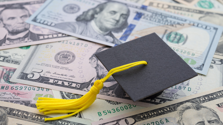 money and a graduation cap