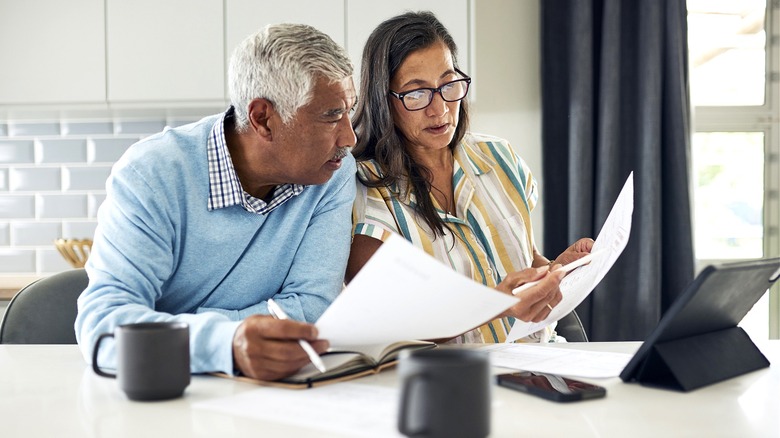 Retired couple budgeting together