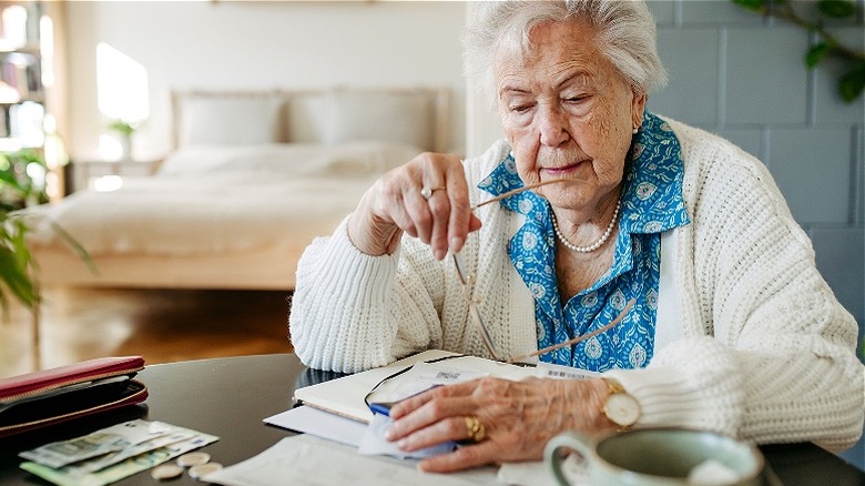 Retired woman looking at finances