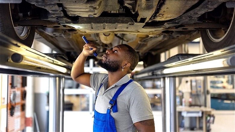 Mechanic inspecting a vehicle