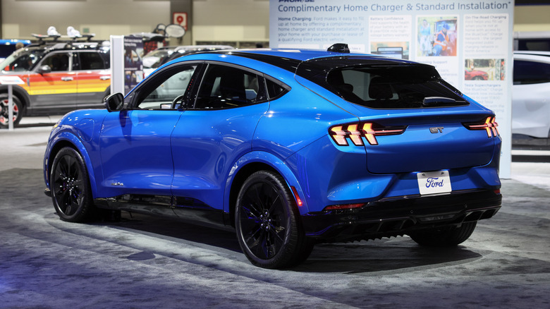 A blue Ford model on display at an auto show.