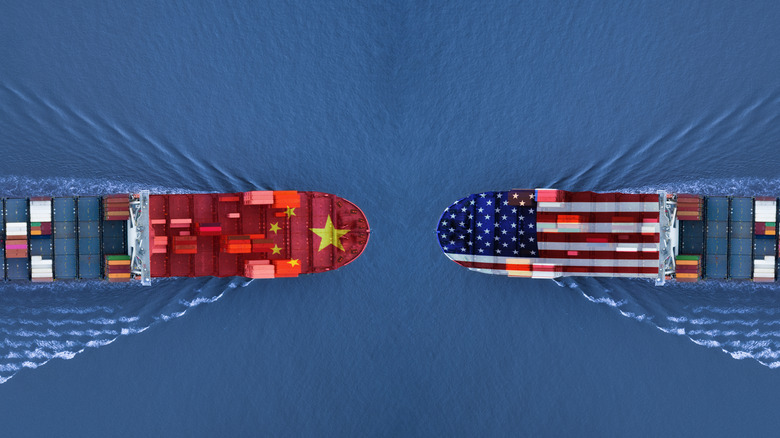 Two cargo ships overlayed with the Chinese and American flags