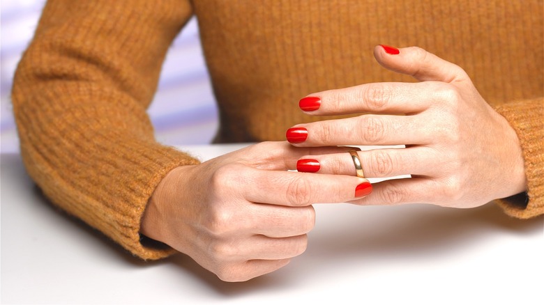 Woman removing her wedding ring