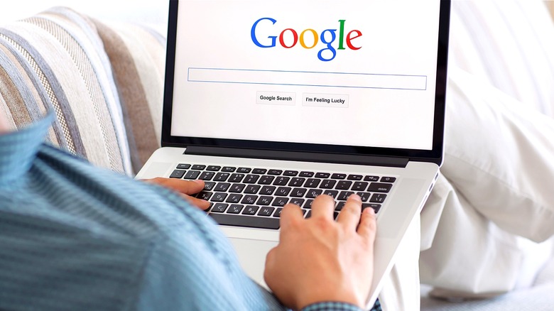 Person using Google search engine