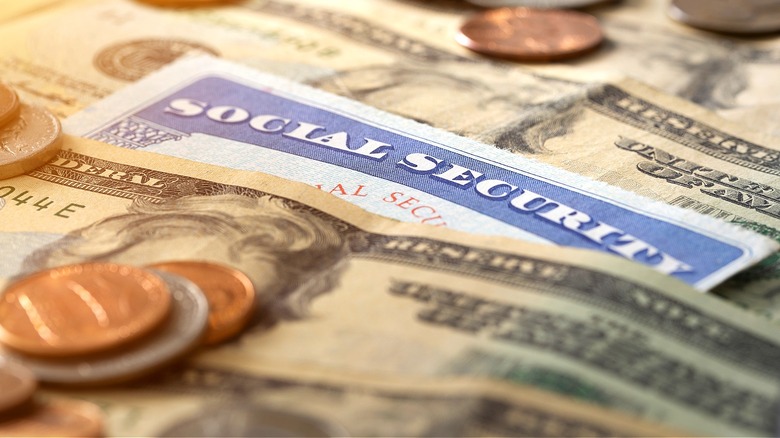 Social Security card among money