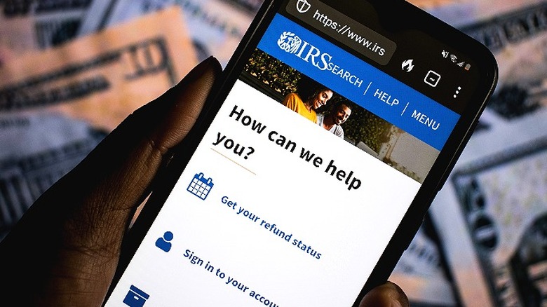 IRS website on phone with question 'How can we help you?'