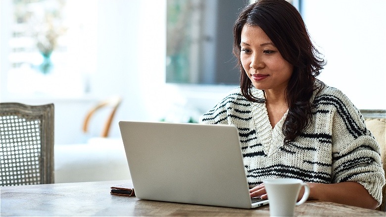 Person using computer at table