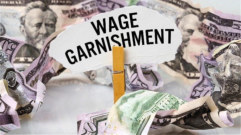 "Wage Garnishment" with crumpled money