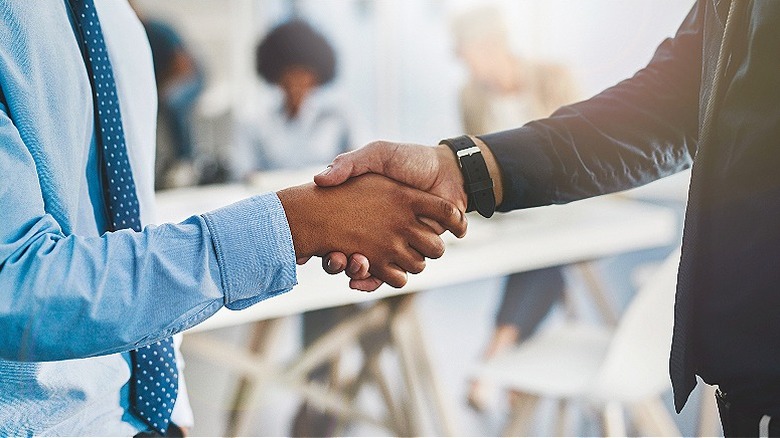 Two people shaking hands