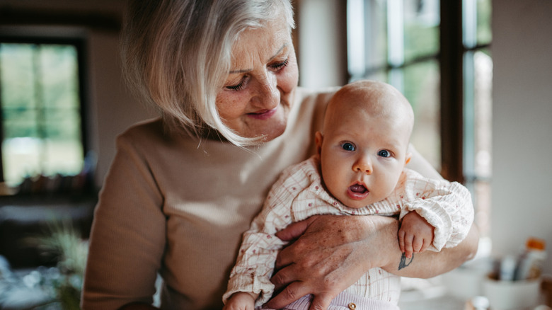 grandmother holding baby