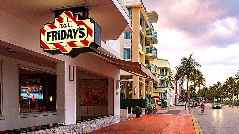 Sidewalk view of a TGI Fridays with a cloudy sky