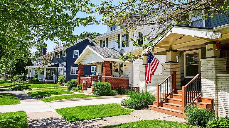 Sidewalk and row of houses on a sunny day