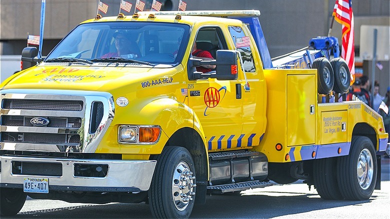 Yellow AAA tow truck