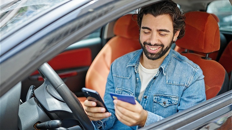 Person smiling in car