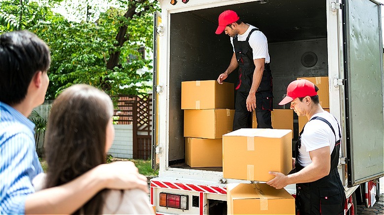 Person loading moving boxes