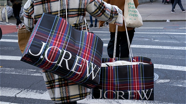 Person with J. Crew bags