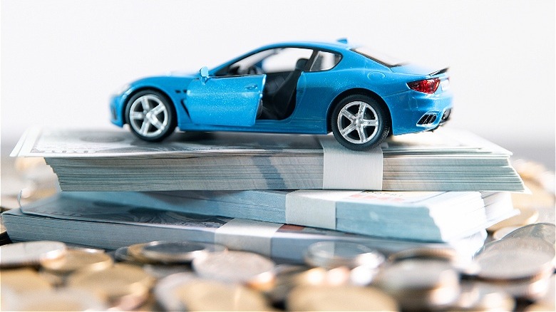 Model car sitting on money