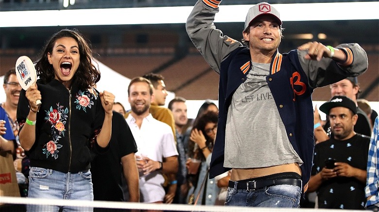 Ashton Kutcher, Mila Kunis celebrating