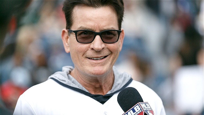 Charlie Sheen smiling, being interviewed