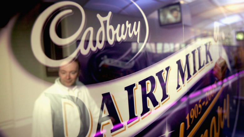 Cadbury Dairy Milk display and worker at Birmingham, England factory