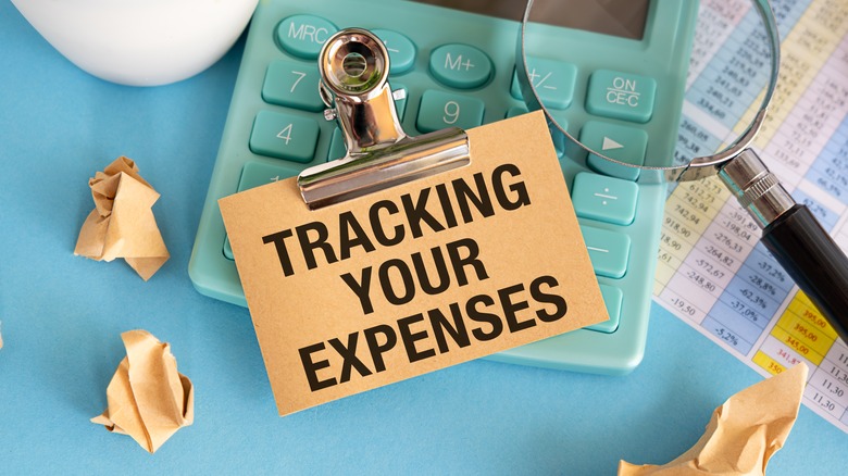 note reading 'tracking your expenses'