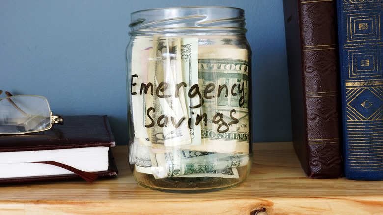 a jar labeled emergency savings