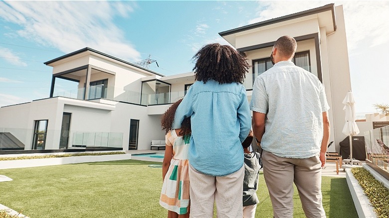 Family looking at a house