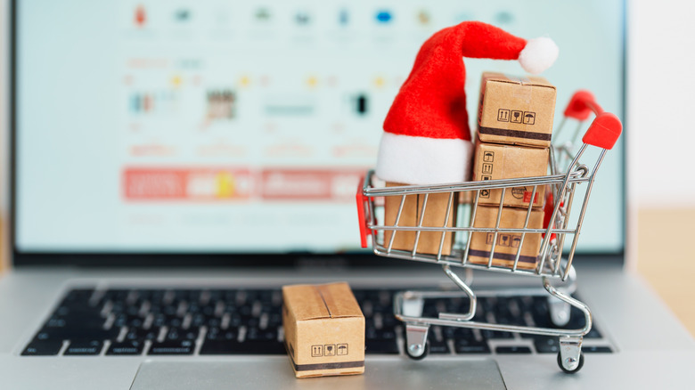 Miniature shopping cart filled with packages