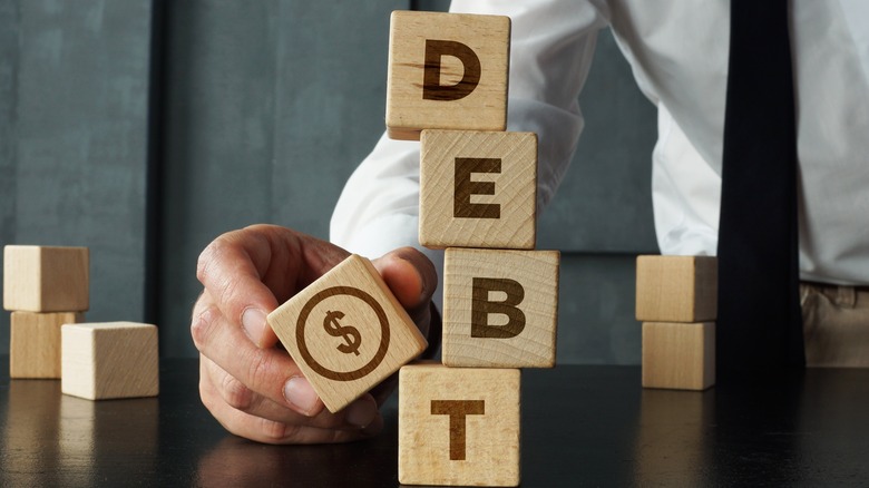 debt spelled in blocks