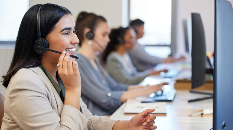 A line of call center agents working.