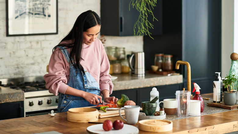 Woman cooking food at home