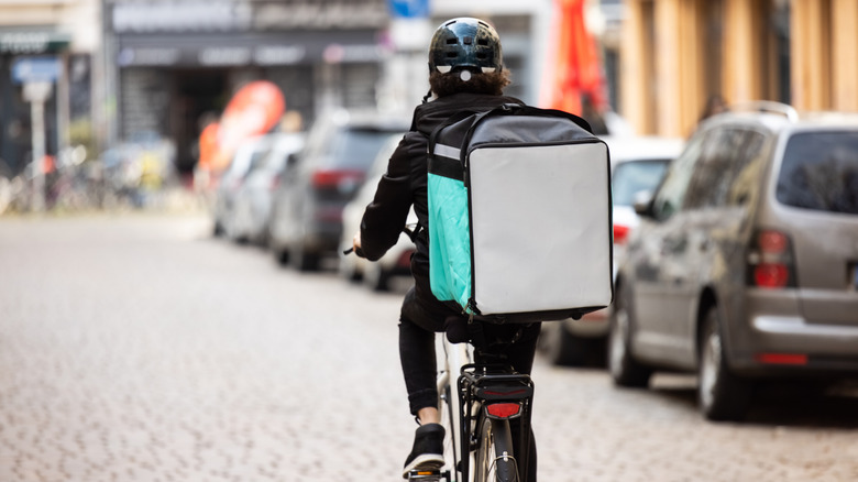 Food delivery person on bicycle