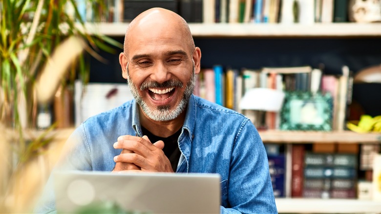 Smiling worker on video call