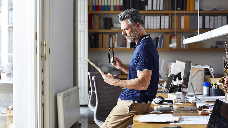 Worker using tablet at home