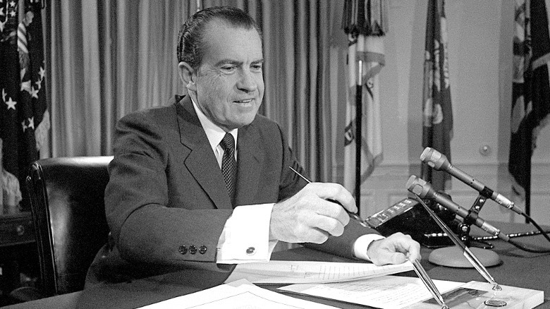 President Richard Nixon signing papers